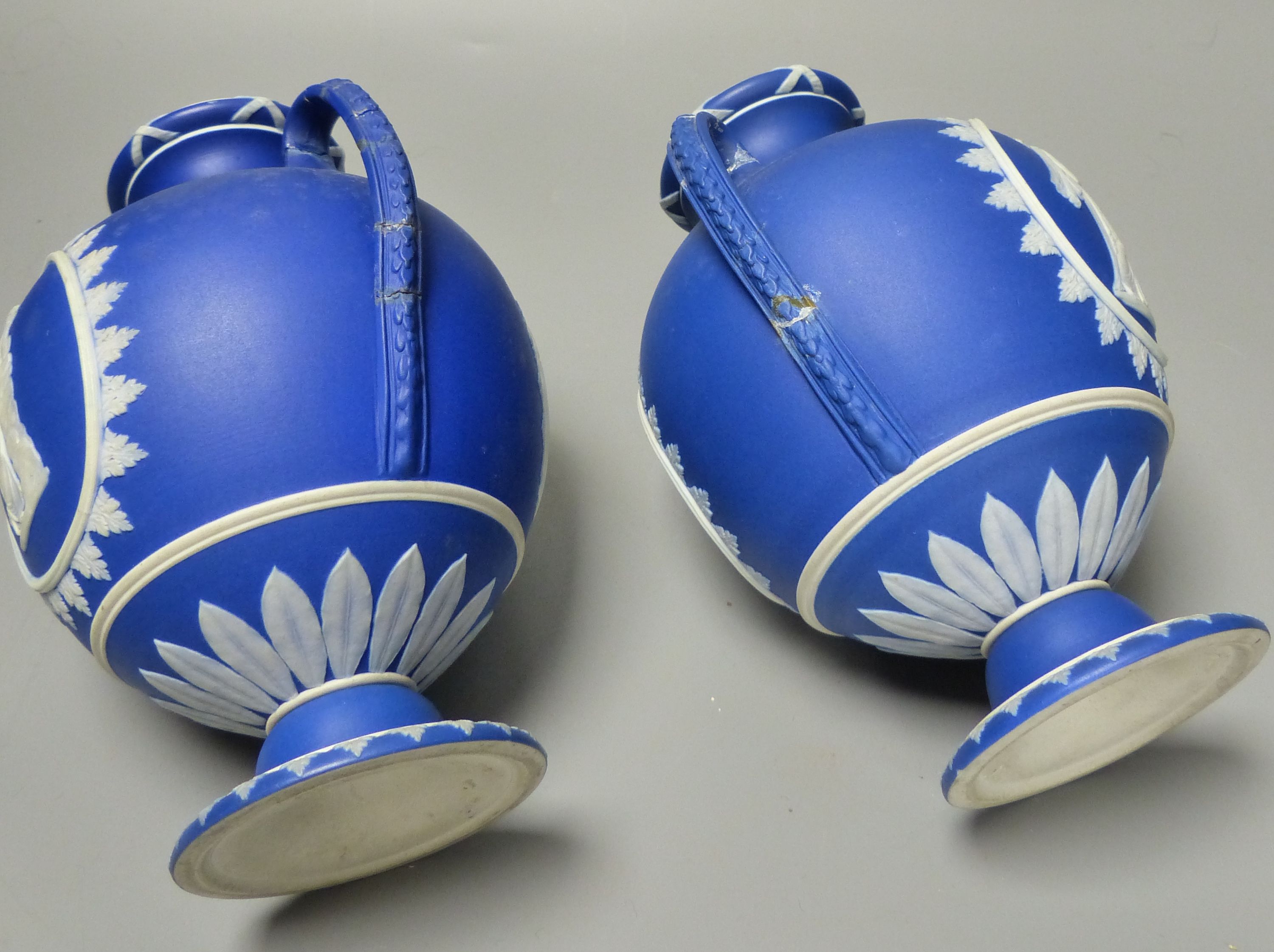 Four pieces of Wedgwood jasper wares including a pair of Victorian blue jasper vases, height 18.5cm, and later dish and pin dish